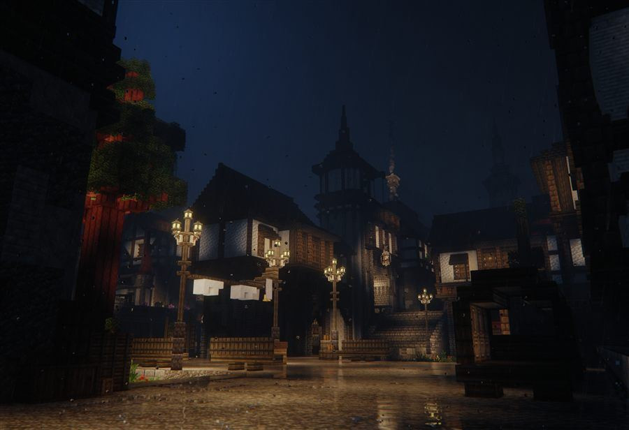 A lamplit town street at night